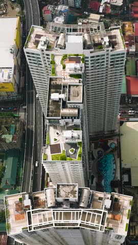 View of Hotels and Business Buildings in Makati City. Busy streets in Metro Manila, Philippines. Vertical view.
