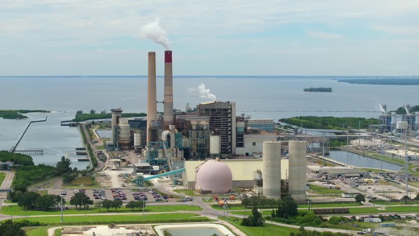 Coal and natural gas run power station in Tampa, Florida. Major coal-fired power plant producing electricity. Fossil fuel usage for energy production