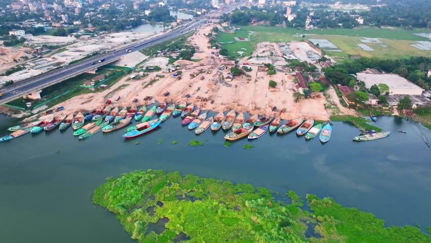 Riverside Colorful Cargo Boats Docked at Dhaka Chittagong highway Daudkandi Bridge Bangladesh