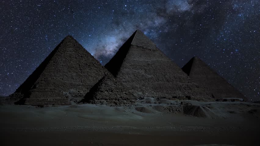 Egypt Great Pyramid of Giza and Milky Way Galaxy in the Night Sky. Timelapse of Pyramid complex of Giza at night. Giza, Cairo, Egypt. The Great Pyramids of Giza, Time Lapse at night. Unesco World Site