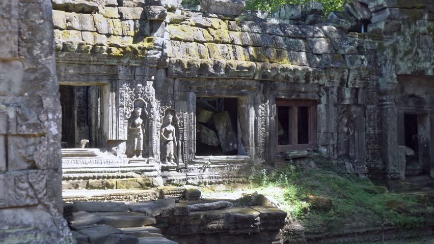 Angkor Wat, A remarkably tall building set against dense jungle backdrop