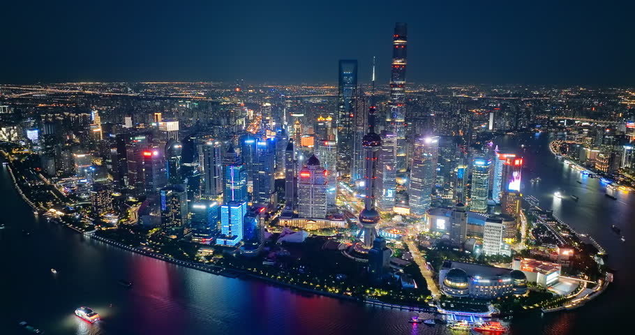 Aerial view of Shanghai skyline at night. Business and financial background in China.
