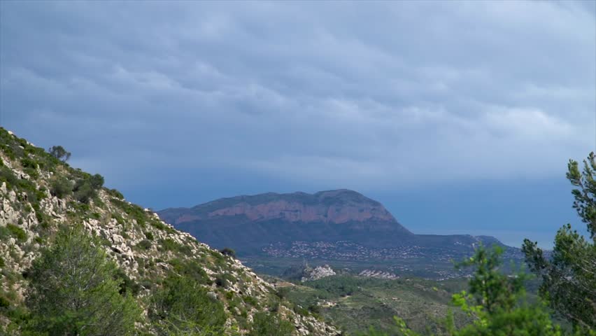 Slow motion, landscape with mountains on a clody day, Montgo in Denia, Cumidad Valenciana (Spain)
