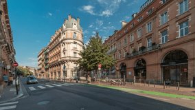 Panorama showing Rue de Metz timelapse in Toulouse, Occitanie, France, with historic facades, shops, cafes, traffic and a blue cloudy sky. Vibrant urban scene in the heart of the city - Powered by Shutterstock - Get 15% off with code: PIKWIZARD15
