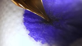 Macro of Blue Ink Flowing from Retro Fountain Pen Nib, Absorbing into Paper. - Powered by Shutterstock - Get 15% off with code: PIKWIZARD15