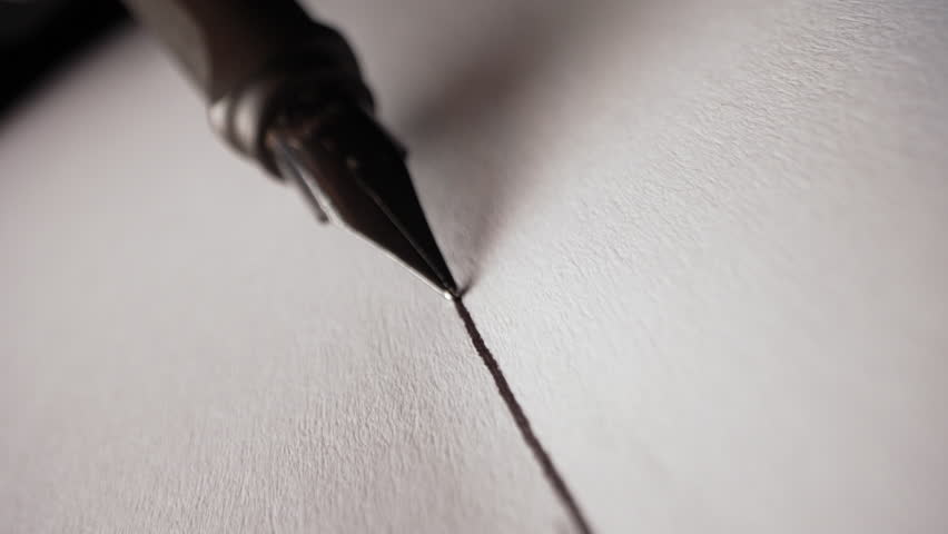 Macro of Fountain Pen Nib Writing Straight Ink Line On Textured Paper Surface 