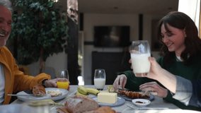 Family members are sharing a pleasant breakfast time in their contemporary home - Powered by Shutterstock - Get 15% off with code: PIKWIZARD15