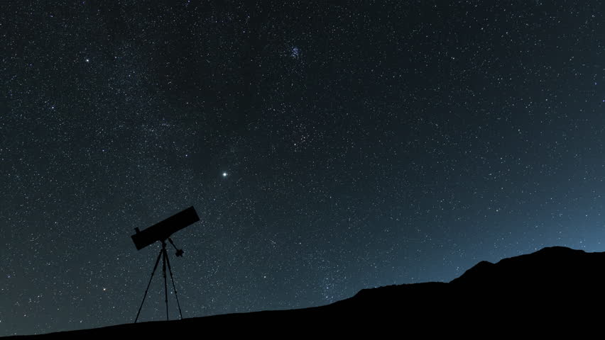The telescope stands  on the hill on the  Milky Way galaxy and  mountains background. Night tight landscape starry sky. 
