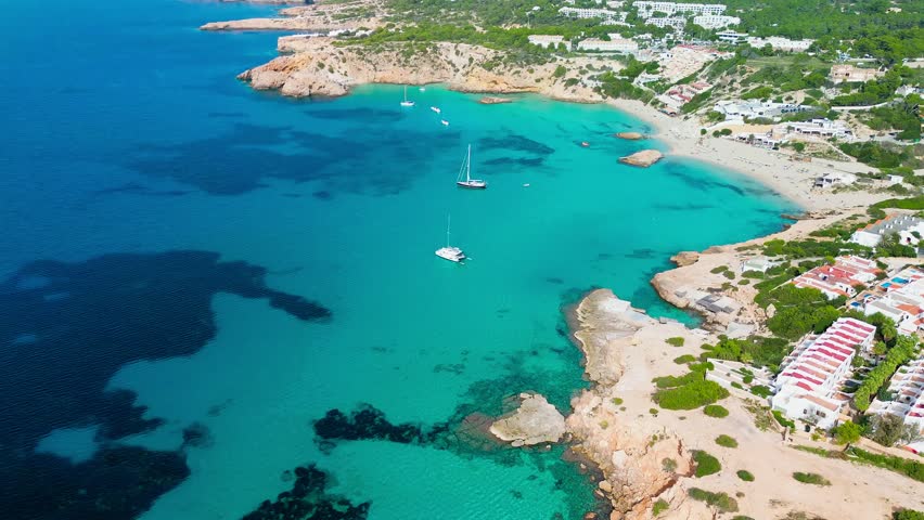 Aerial drone view of a beautiful coast and sea in Cala Tarida, Ibiza island, Spain