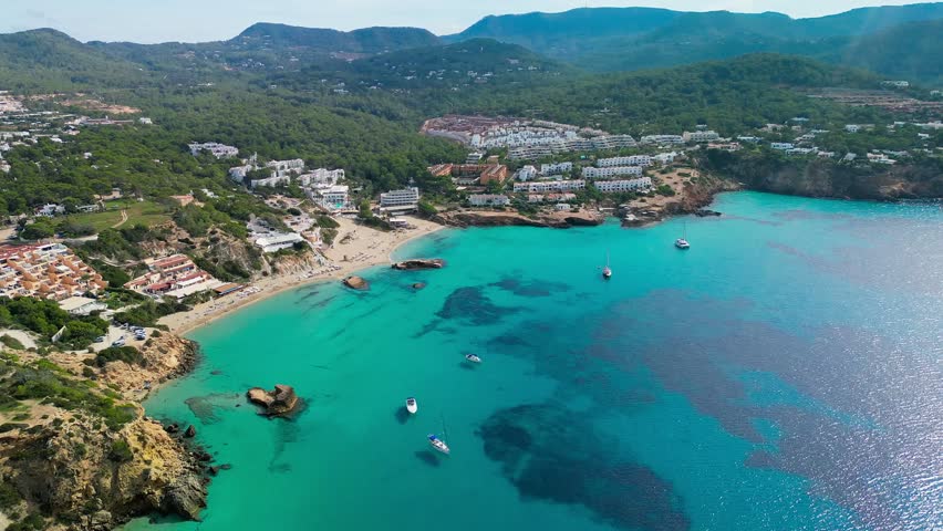 Aerial drone view of a beautiful coast and sea in Cala Tarida, Ibiza island, Spain