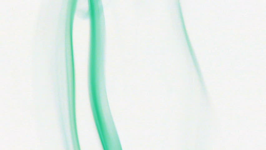 Colored fluid slow motion on white background