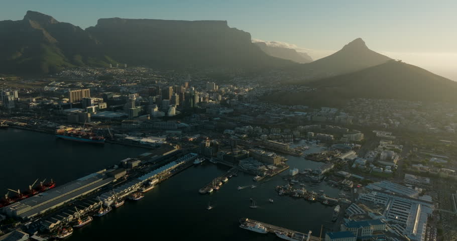 Establishing Aerial view of Cape Town Central Business Downtown District and Table Mountains in South Africa. Urban Cityscape of Capital with Skyline and Landscape. 4K wide drone shot