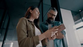 Creative millennials, casual business team, small business owners, working on social media strategy and brand development with a digital tablet in a modern, open space startup office - Powered by Shutterstock - Get 15% off with code: PIKWIZARD15