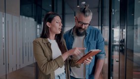 Creative millennials, casual business team, small business owners, working on social media strategy and brand development with a digital tablet in a modern, open space startup office - Powered by Shutterstock - Get 15% off with code: PIKWIZARD15