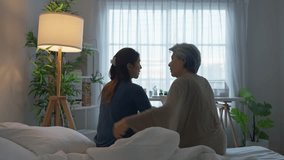 Rear view of elderly mother comfort upset daughter crying for problem. Caring senior mature mom support, consoling and understand empathy to stressed young woman in tears at home. Family relationship. - Powered by Shutterstock - Get 15% off with code: PIKWIZARD15