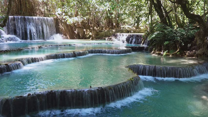 A spectacular Kuang Si Waterfall amid a lush forest, Laos
