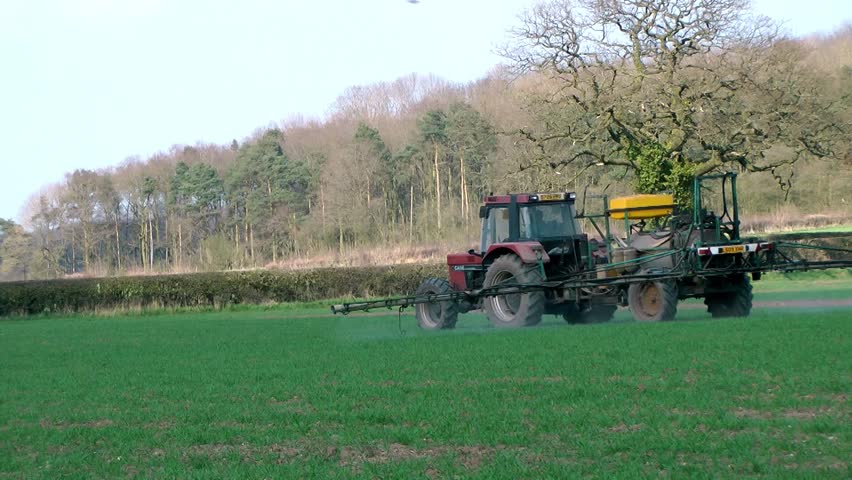 Agriculture - Tractor Spraying Crops