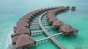 Drone flight over luxury water villas, Maldives. Aerial low flight - Powered by Shutterstock - Get 15% off with code: PIKWIZARD15