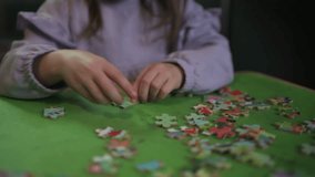 Girl Having Fun Sitting At Table At Home Doing Jigsaw Puzzle - Powered by Shutterstock - Get 15% off with code: PIKWIZARD15