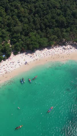 Vertical Drone Shot, White Sand Beach, Green Rainforest and Turquoise Sea WIth Tourists and Boats