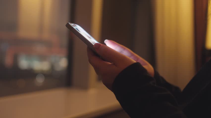 woman using phone read news  surfing internet at night