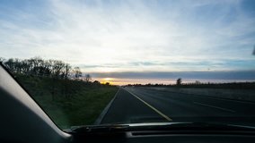 Driving on motorway during sunset, time laps