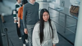 Airport Security Checkpoint: Queue of Multiethnic Passengers Passing Biometric Facial Recognition at Passport Control. Advanced AI Big Data Analyzing Technology. People Screening for Boarding Flight. - Powered by Shutterstock - Get 15% off with code: PIKWIZARD15