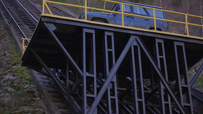  Close up of funicular car lift on a track in a forested area