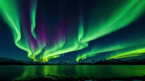 the stunning natural beauty of the aurora borealis on the surface of a calm lake. - Powered by Shutterstock - Get 15% off with code: PIKWIZARD15