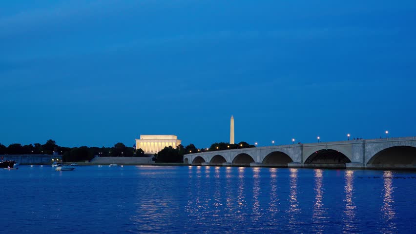 Washington DC Monuments, Arlington Memorial Bridge, and the Potomac River at night.