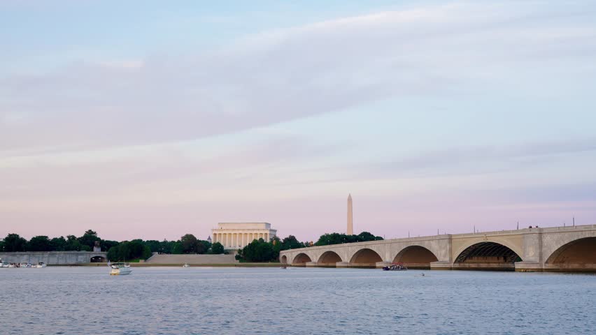 Washington DC Monuments, Arlington Memorial Bridge, and the Potomac River at sunset.