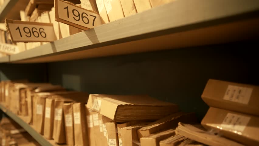 Old Document In Archive Department. Archival Material. Bookkeeping File Shelf. 
Archive Texts In Films And Reports. Highly Classified Documents. National Archives Records. Old Secret Archival Document