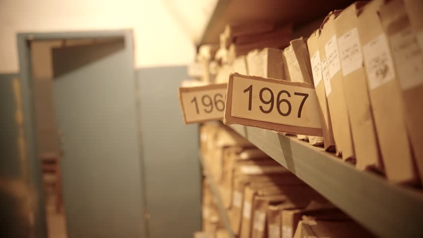 Old Document In Archive Department. Archival Material. Bookkeeping File Shelf. 
Archive Texts In Films And Reports. Highly Classified Documents. National Archives Records. Old Secret Archival Document