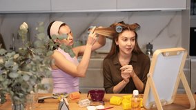 Adult woman doing hair perm with curlers to young woman - Powered by Shutterstock - Get 15% off with code: PIKWIZARD15