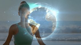 Woman meditating with glowing Earth animation over serene ocean background. Meditation, tranquility, spirituality, nature, cosmic, peace - Powered by Shutterstock - Get 15% off with code: PIKWIZARD15