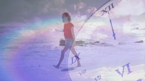 Walking on beach, woman with clock face overlay and rainbow animation effect. surreal, abstract, time, creativity, dreamlike, fantasy - Powered by Shutterstock - Get 15% off with code: PIKWIZARD15