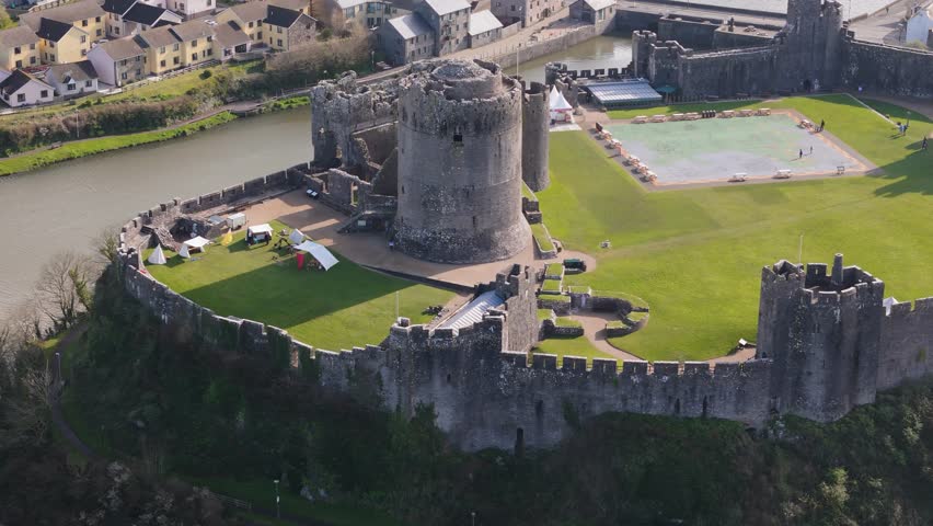 Drone shot Pembroke Castle in the city of Wales, UK