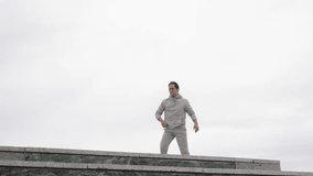 Parkour athlete performing acrobatics on building ledge - Powered by Shutterstock - Get 15% off with code: PIKWIZARD15
