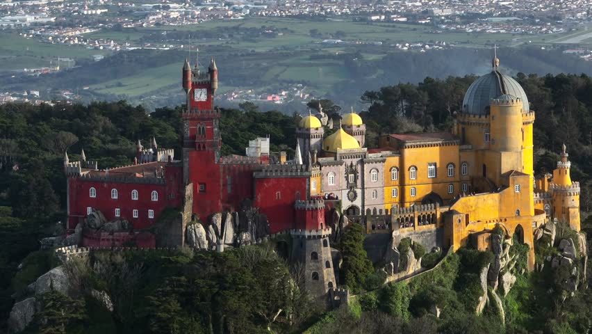 National Palace of Pena in Sintra, Lisbon, Portugal. Aerial parallax Drone Shot of famous historic Pena palace castle. 