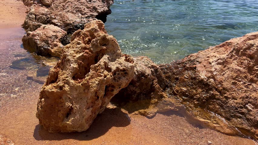 Rocky Shoreline with Clear Blue Sea in Egypt