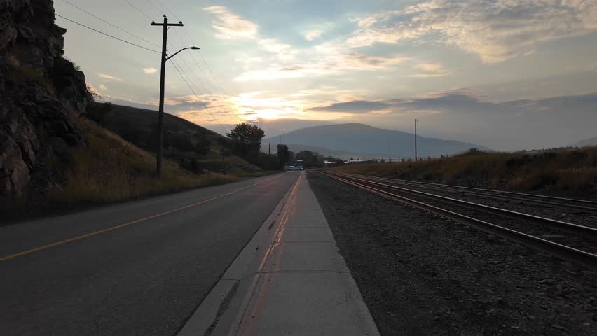 Sunrise Over Road and Railway Tracks in Rural Alberta, Canada