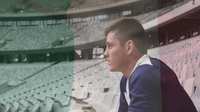 In stadium, rugby player holding ball and sitting, looking thoughtful. Athlete, sports, competition, outdoors, team sport, uniform - Powered by Shutterstock - Get 15% off with code: PIKWIZARD15