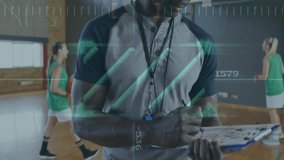 Coach in gymnasium with data processing animation over basketball practice. Sports coaching, analysis, technology, performance, digital overlay, fitness - Powered by Shutterstock - Get 15% off with code: PIKWIZARD15