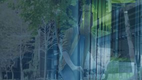 Person riding bicycle with digital data animation overlay in urban park setting. Cycling, technology, cityscape, futuristic, outdoor, exercise - Powered by Shutterstock - Get 15% off with code: PIKWIZARD15