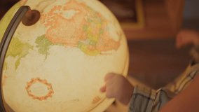 Boy Playing With Globe with father. Little kid Looking at lighting sphere, happy time with daddy. Exploring World, Learning. Child care, sweet time before going sleep. Concept of family and childhood. - Powered by Shutterstock - Get 15% off with code: PIKWIZARD15