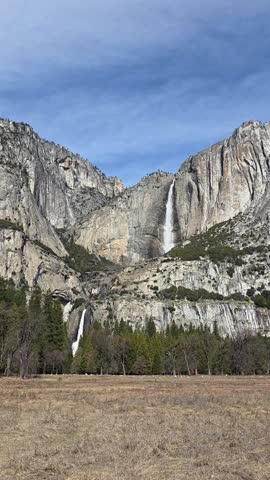 Natures beautiful double waterfall cutting through the wild mountain side