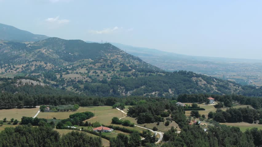 Hilly countryside and farmland in Serres, Greece. Aerial drone panoramic view, copy space