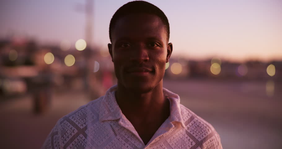 Face, smile and black man in city outdoor for summer vacation, travel or urban sightseeing. Portrait, happy and male person with holiday sunrise, calm morning and weekend break for getaway in Florida