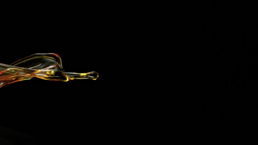 Ultra Slow Motion Golden Oil Splash at 1000fps, Liquid Wave on Black Background