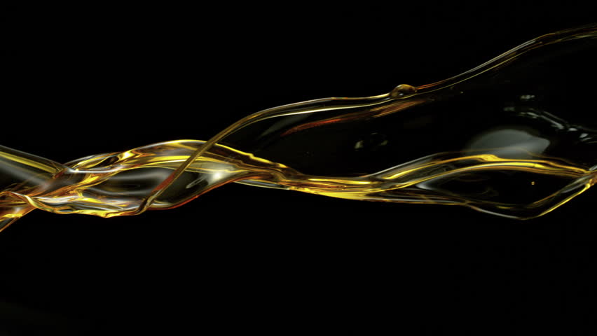 Ultra Slow Motion Golden Oil Splash at 1000fps, Liquid Wave on Black Background